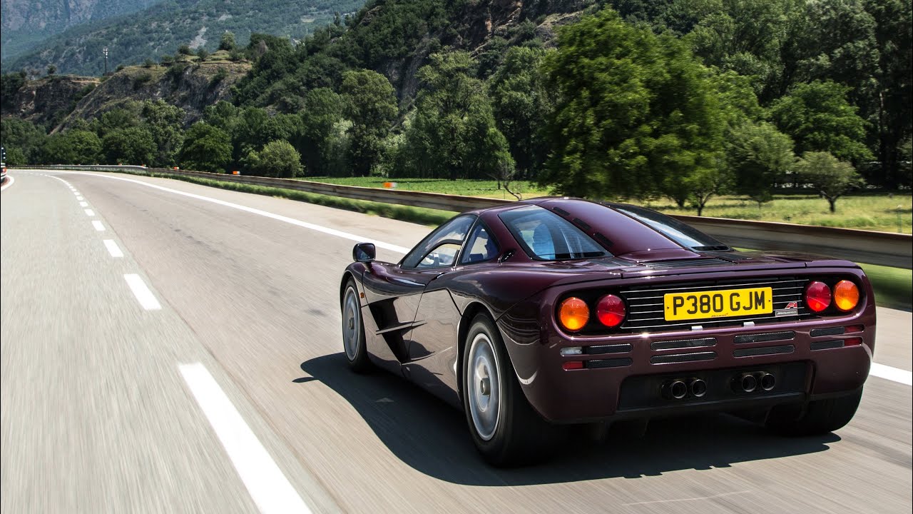 Purple McLaren F1 on the road.